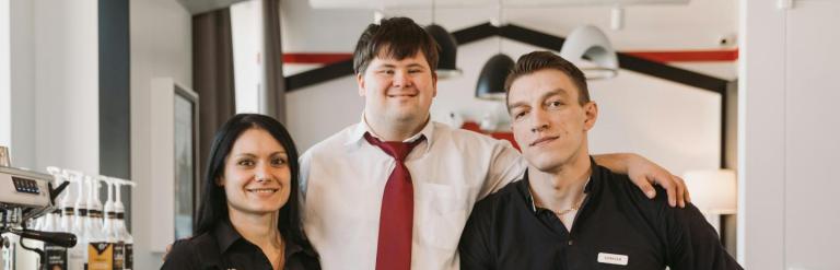 3 cafe workers including a young man with downs